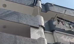 Adana’da balkon filesine sıkışan güvercin kurtarıldı